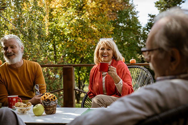 istock Beautiful elderly friends hanging out on Autumn day 2241231607