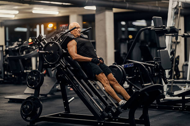 istock Senior man performing leg press in gym 2241235077