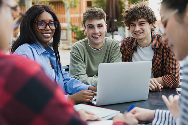 istock Happy university students team learning and working together, studying for exams at college campus 2241236033