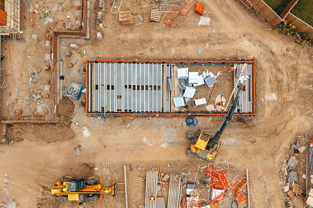 istock Construction site showing heavy equipment and building materials during daytime in a developing area 2241237551