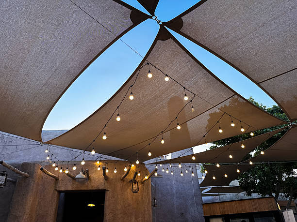 istock Al Seef Courtyard Canopy with String Lights. Dubai Old Town Evening Scene 2241238400