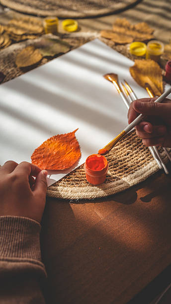 istock Autumn art project with leaf and paint 2241239394