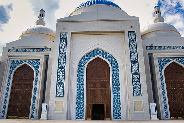 istock Ornate Islamic Mosque Gleaming Under Blue Skies 2241243194