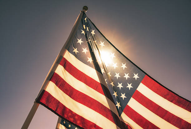 istock Sunlight shining through of American flag in the morning 2241244310