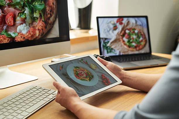 istock Woman Using Tablet for Food Photography Editing 2241245471