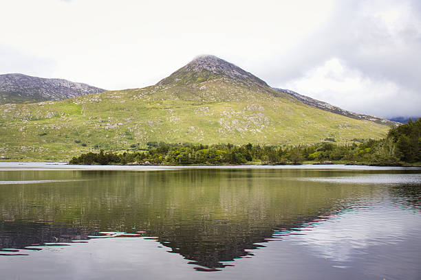 istock Serene Irish mountain lake reflects rugged landscape 2241247840