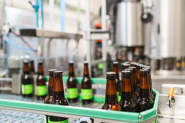 istock Beer bottles moving on conveyor belt in modern brewery 2241250116