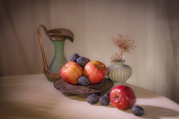 istock Beautiful background with apples and plums 2241250312