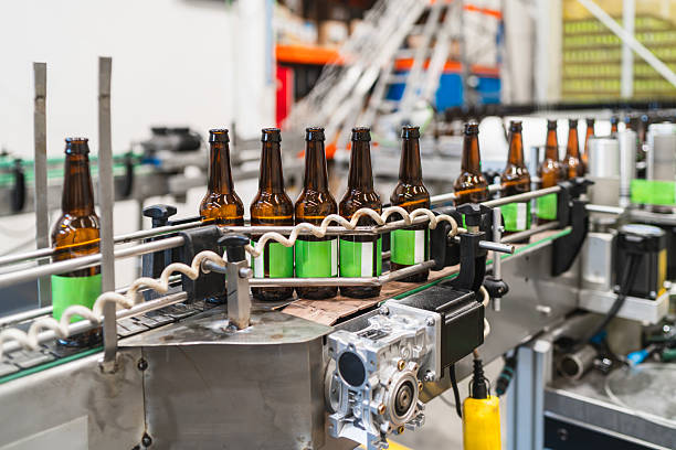 istock Beer bottles moving along production line in brewery 2241250353