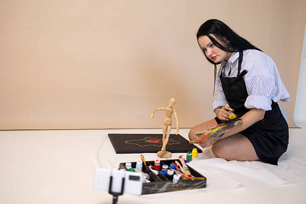 Focused Artist Mixing Colors on Palette