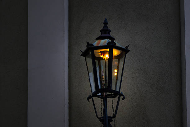 Lantern glows warmly, creating cozy nighttime ambiance.
