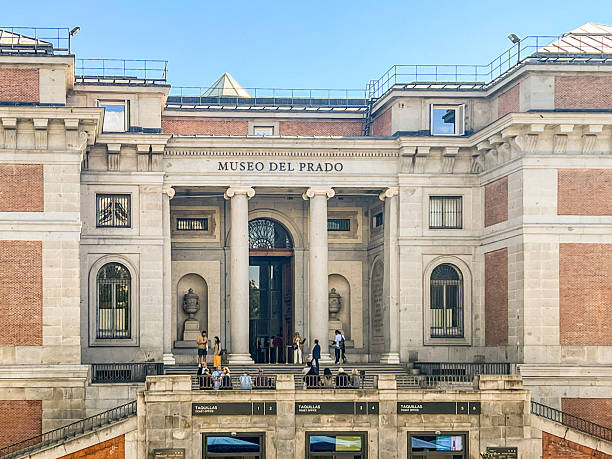 Madrid, Spain - September 22, 2025: Main entrance to El Prado Museum, a world class art museum in Madrid, Spain. Tourists are waiting in front.