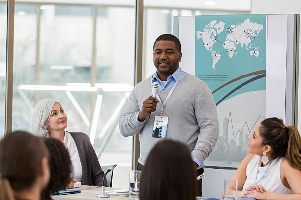 istock Speaker presenting business data at a conference to an engaged audience. 2241257207