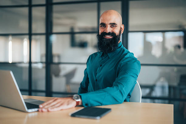 istock Confident young businessman managing work online 2241264678