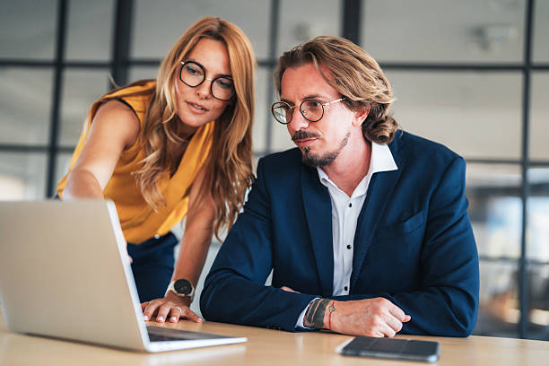 istock Business colleagues communicating and collaborating in an office 2241264681