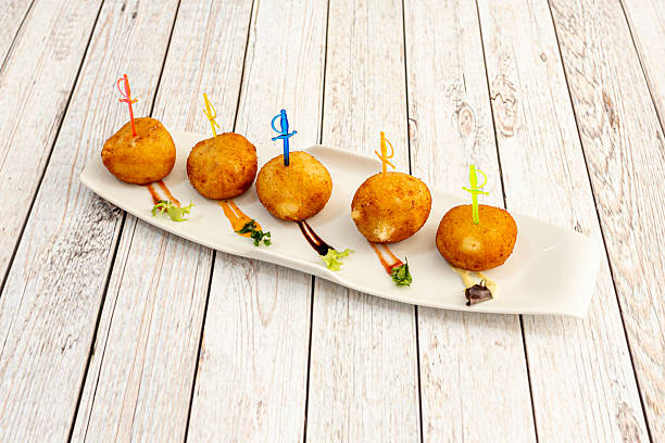 istock Homemade serrano ham croquettes on a white tray 2241268090