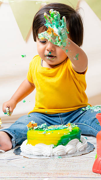 istock Toddler smashing first birthday cake making a mess 2241270731