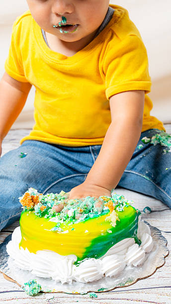 istock Baby playing with cake during first birthday smash celebration 2241270842