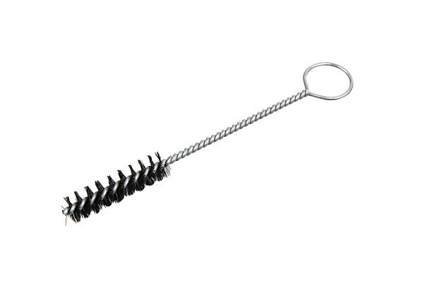istock Small, cylindrical bristle cleaning brush with a twisted wire handle and finger loop, isolated on white. 2241271194