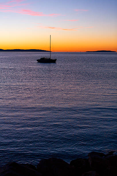 istock Sailboat at Sea During Sunset – Tranquil Coastal Scene 2241273487