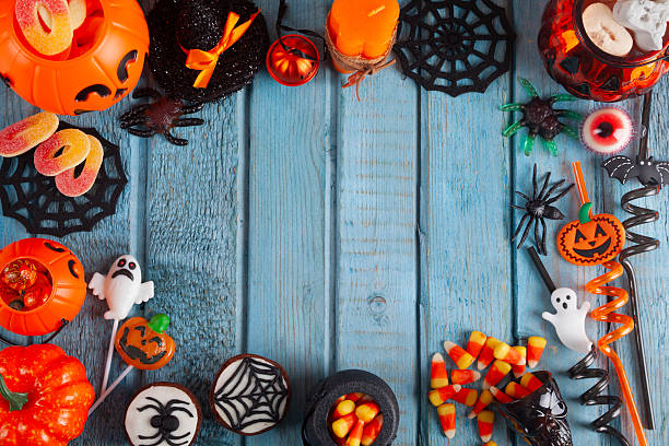 istock Halloween party decorations frame on blue wooden rustic table 2241274847