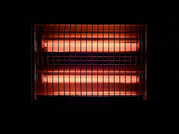 An abstract, warm red light source creating vertical, rhythmic streaks, likely from a textured lens or grating