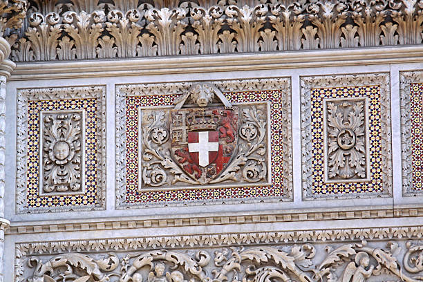Florence, Italy - September 30, 2009: Carved Coat of Arms at Florence Cathedral Cattedrale di Santa Maria del Fiore.