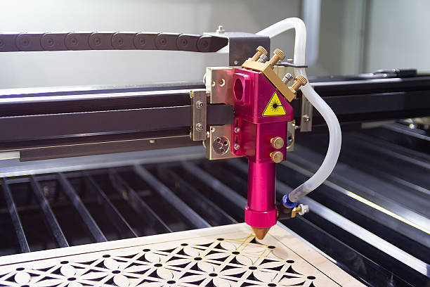 istock Laser engraving machine carves a design on a wooden surface 2241281622