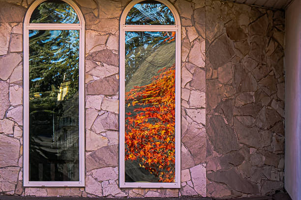 Burnaby BC Canada - October 14, 2025: Brilliant shades of red and gold light up Tyndale Crescent in Burnaby, where every maple tree seems to be on fire with autumn color. the quiet street glows in the soft fall sunlight - a perfect moment of seasonal beauty