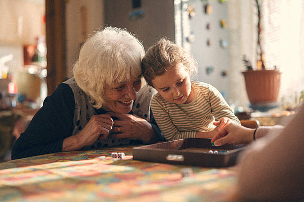 istock Family Care. Playing Board Game and Sharing Fun Moments 2241286030