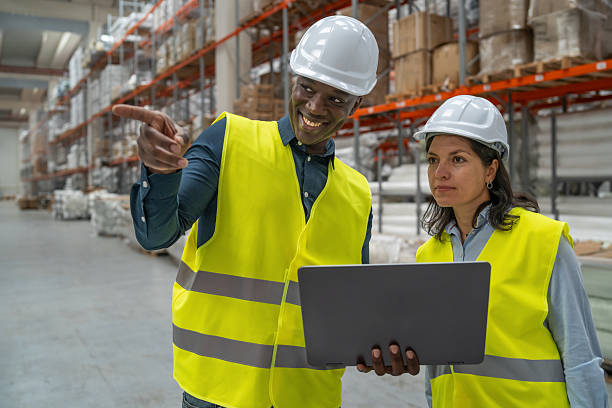 istock Smiling Worker Engages with Colleague over Laptop Data 2241286059