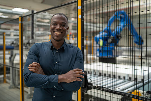 istock Confident Factory Worker in Professional Attire Smiling 2241286062