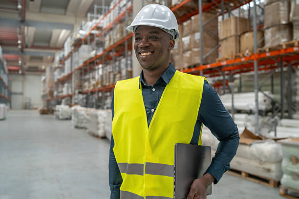 istock Smiling Worker in Warehouse: A Picture of Professionalism 2241286097