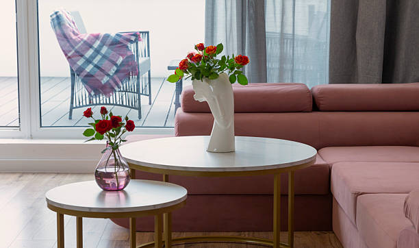 istock roses in vases on round tables at home 2241286538
