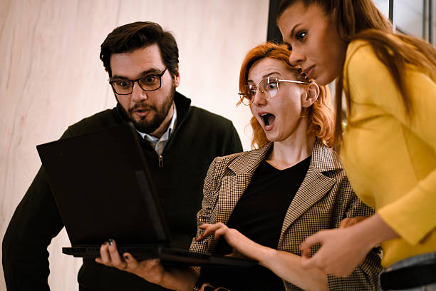 istock Colleagues surprised by new project results while working in a modern office environment during the afternoon 2241286741