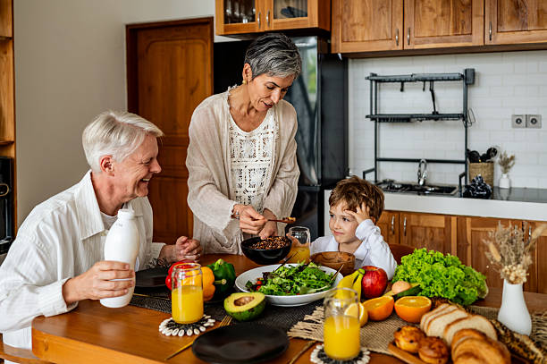 istock Family Breakfast With Fresh Produce And Cheerful Conversation Around A Bright Kitchen Table 2241287339