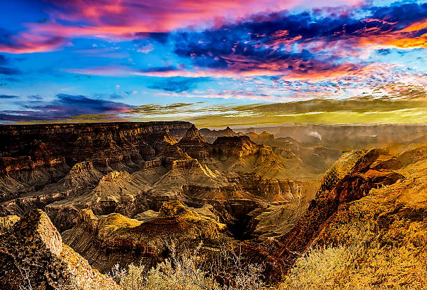 Looking south from the North Rim of the Grand Canyon. In the distance you can see two small fires in the canyon. This picture was taken before the devastating fire in July 2024 that destroyed the lodge. Picture was taken just a few minutes walk from the lodge.