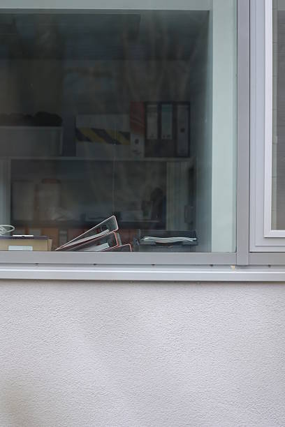 istock A window with a pair of scissors on the sill 2241290414