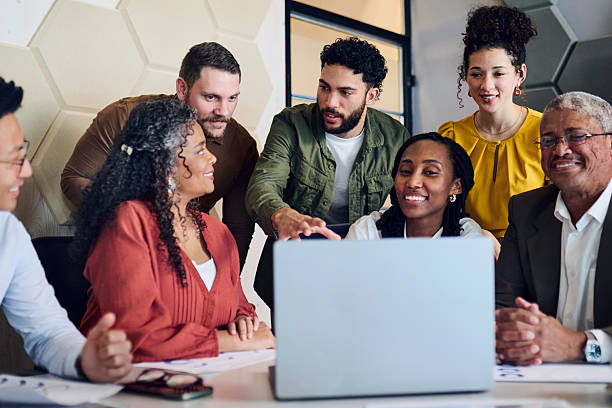 istock Diverse Business Team Discussing Project on Laptop 2241294295