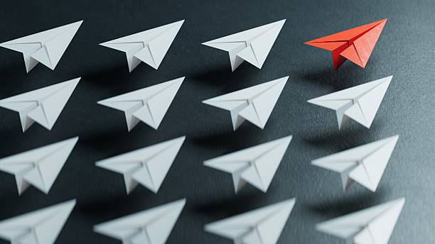 istock Different business concept.new ideas. paper art style. creative idea.Red and white paper plane. Leaderplane concept.3D rendering on black background. 2241294863