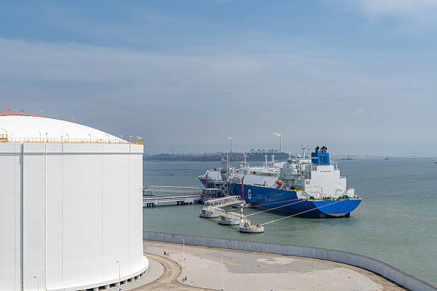 istock Large storage tanks and loaded cargo ships in LNG ports 2241298568