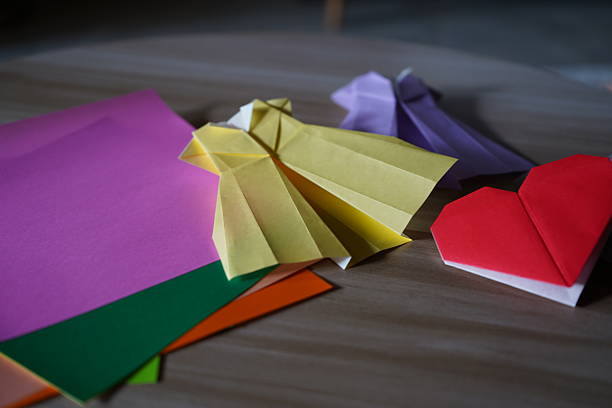 Child playing with origami shuriken