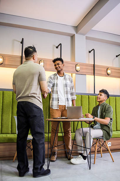 istock Asian Men Shake Hands Signifying Closed Deal in Office 2241308266