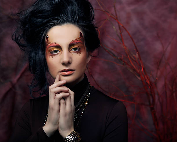 istock Beautiful brunette woman with bright creative make up 2241314372