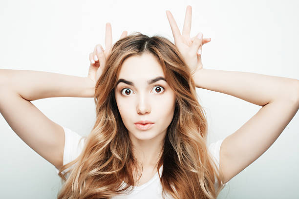 istock Young beautiful woman posing with white t-shirts, ower white background 2241314405
