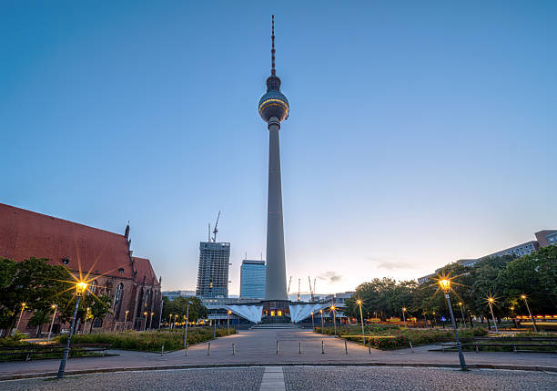 Detail of the sphere from the television tower in Berlin. Part of the tallest building in the capital of Germany with reflections on the window panes of the glass front in the evening in the sunshine.