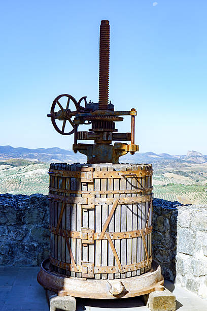istock Antique grape press machine in olvera, cadiz, spain 2241317550