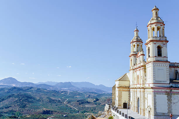 istock Olvera church architecture overlooking andalucian olive groves landscape in olvera,cadiz,spain 2241317556