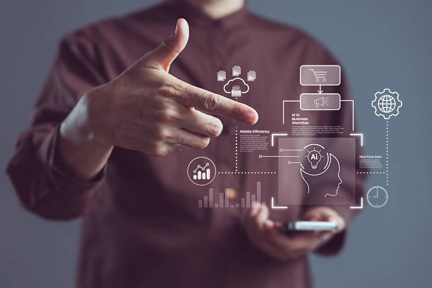 istock Businessman using hand gesture and smartphone to interact with AI interface for cloud computing, data analytics, mobile efficiency, and smart business automation 2241320951