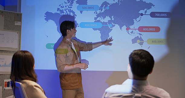 istock Asian businessman presenting data analytics to team during night office meeting 2241326814
